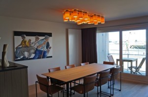 carillon ceiling lamp in maple wood - 22 different tubes above dining table 